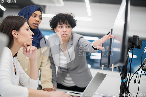 Image of multiethnics team of software developers working together