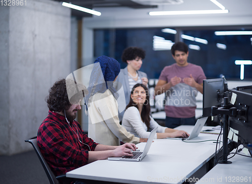 Image of multiethnics team of software developers working together