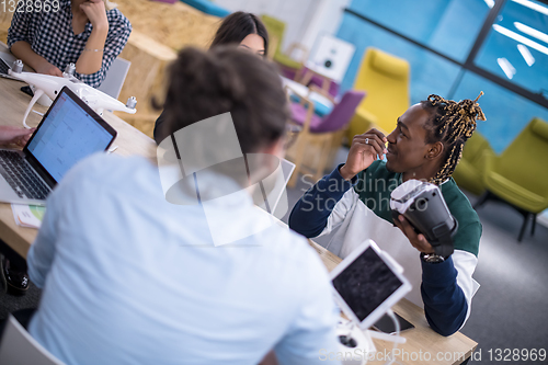 Image of Young Multiethnic Business team using virtual reality headset