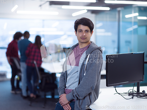 Image of Portrait of smiling male software developer