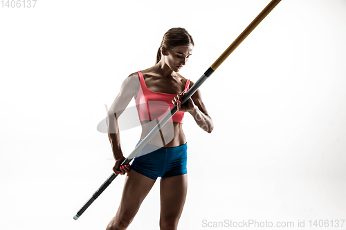 Image of Female pole vaulter training on white studio background