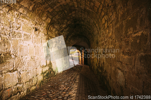 Image of Kuressaare, Saaremaa Island, Estonia. Passage Entrance To Episcopal Castle. Traditional Medieval Architecture, Famous Attraction Landmark. Episcopal Castle In Night. Traditional Medieval Architecture