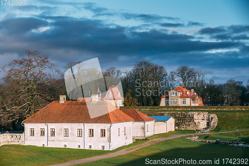 Image of Kuressaare, Saaremaa Island, Estonia. Old House Building Near Episcopal Castle In Evening. Traditional Medieval Architecture, Famous Attraction Landmark