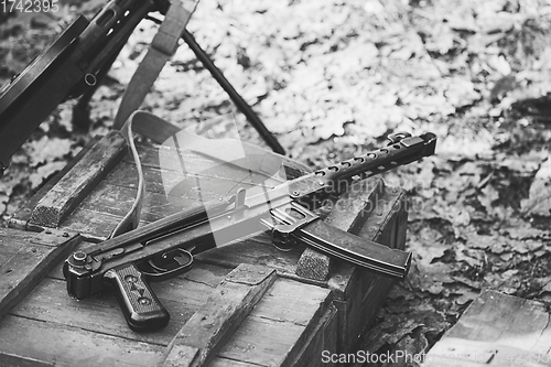 Image of Old Soviet Russian Red Army Submachine Gun PPS-43 Weapon Gun Of World War II Lying On The Wooden Box. Black And White Photo