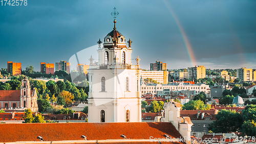 Image of Vilnius, Lithuania. Sunset Cityscape Of Vilnius, Lithuania In Summer. Beautiful View Of Old Town In Evening. Sts Johns\' Church Sv. Jonu baznycia . Altered Sky With Rainbow