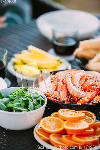 Image of Traditional Snacks Of Mediterranean Cuisine. Shrimps And Oranges