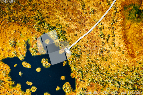 Image of Miory District, Vitebsk Region, Belarus. The Yelnya Swamp. Aerial View Of Yelnya Nature Reserve Landscape. Narrow Wooden Hiking Trail Winding Through Marsh. Cognitive Boardwalk Trail Over A Wetland