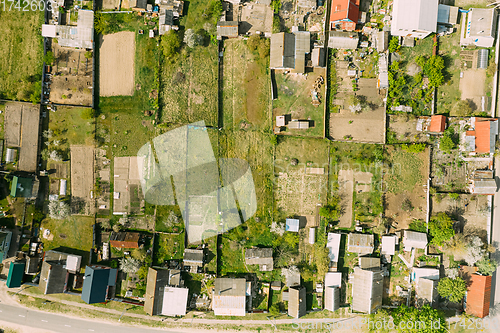 Image of Belarus, Europe. Aerial View Of Small Town, Village Cityscape Skyline In Summer Day. Residential District, Houses And Vegetable Garden Beds In Bird\'s-eye View