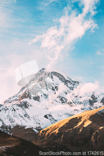 Image of Georgia. Peak Of Mount Kazbek Covered With Snow. Kazbek Is A Stratovolcano And One Of Major Mountains Of Caucasus. Beautiful Georgian Nature Landscape In Early Winter.