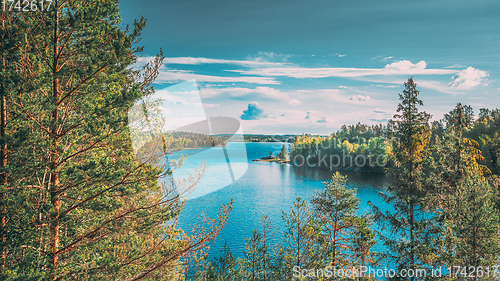 Image of Swedish Nature. Sweden. Summer Lake Or River In Beautiful Summer Sunny Day. Forest Growing On Stone Coast