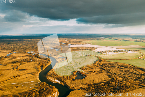 Image of Aerial View Of Dry Grass And Partly Frozen River Landscape In Late Autumn Day. High Attitude View. Marsh Bog. Drone View. Bird\'s Eye View