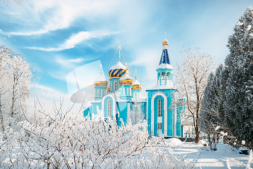 Image of Village Krasnoe, Gomel Region, Belarus. Old Orthodox Church Of The Assumption At Sunny Winter Snowy Day. Famous Landmark In Snowy Park.