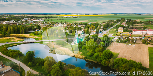 Image of Krupets, Dobrush District, Gomel Region, Belarus. Aerial View Of Old Wooden Orthodox Church Of The Holy Trinity At Sunny Summer Day