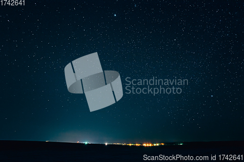 Image of Landscape With Natural Night Sky Stars Background. Starry Sky Over Town