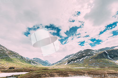 Image of Reinheimen National Park, Norway. Mountains Landscape In Early Summer. Mountain Range In One Of The Largest Wilderness Areas Still Intact In Western Norway