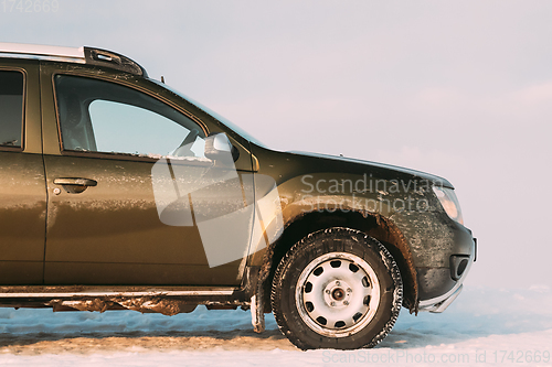 Image of Grungy And Frozen SUV Car On Roadside At Winter Day