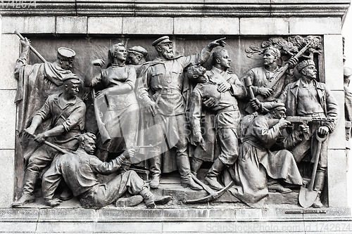 Image of Minsk, Belarus. Bas-relief Scenes On Wall Of Stele Dedicated To Memory Of The Great Patriotic War. Victory Square