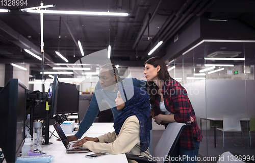 Image of multiethnics team of software developers working together