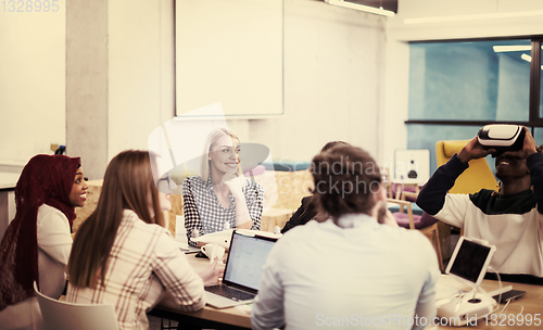 Image of Young Multiethnic Business team using virtual reality headset