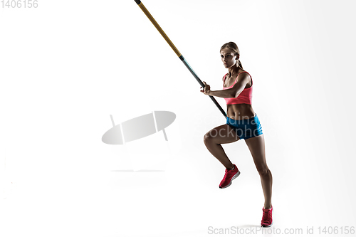 Image of Female pole vaulter training on white studio background