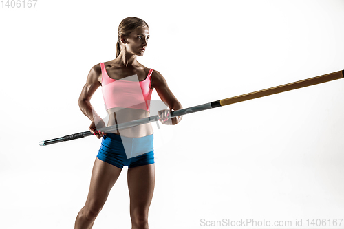 Image of Female pole vaulter training on white studio background