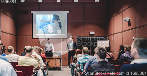 Image of Business speaker giving a talk at business conference meeting event.