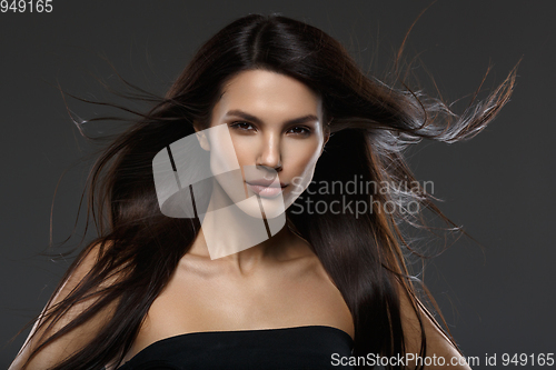 Image of beautiful girl with long flying hair