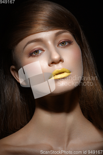 Image of beautiful girl with yellow lips