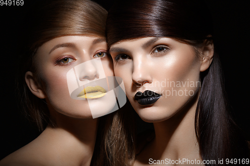 Image of beautiful girls with yellow and black lips
