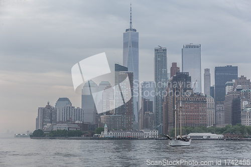 Image of Panoramic view of storm over Lower Manhattan from Ellis Island at dusk, New York City.