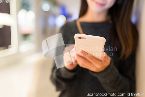 Image of Woman working on cellphone