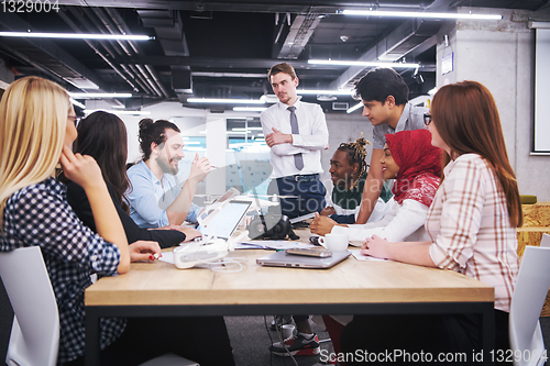 Image of multiethnic business team learning about drone technology