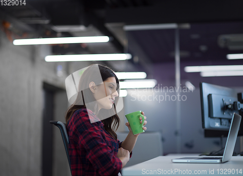 Image of female software developer using laptop computer