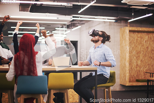 Image of Young Multiethnic Business team using virtual reality headset