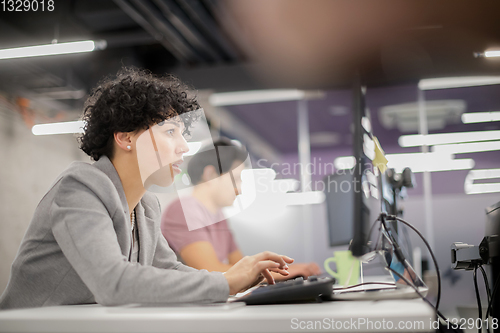 Image of female software developer using desktop computer