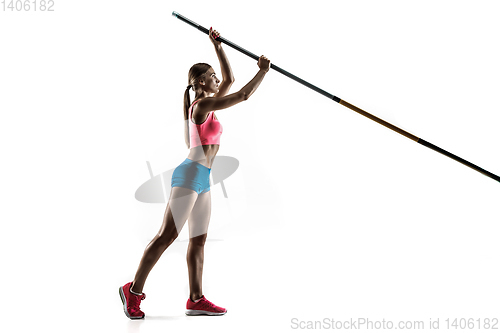 Image of Female pole vaulter training on white studio background