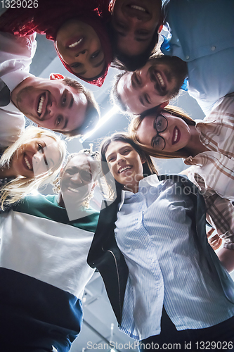 Image of multiethnic Group of young business people celebrating success