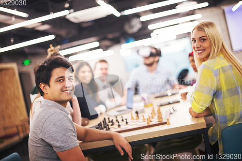 Image of Young Multiethnic Business team using virtual reality headset