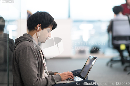 Image of software developer working on the floor