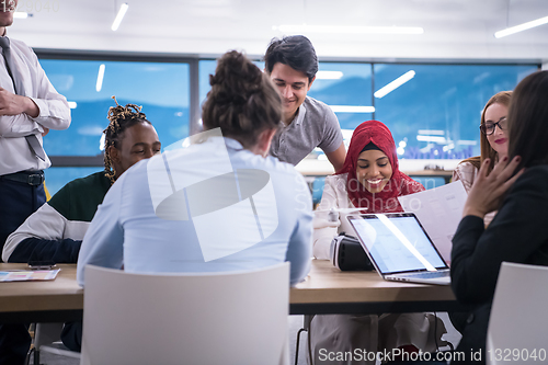 Image of multiethnic business team learning about drone technology