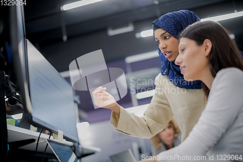 Image of multiethnics team of software developers working together