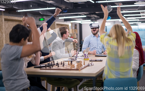 Image of Young Multiethnic Business team using virtual reality headset