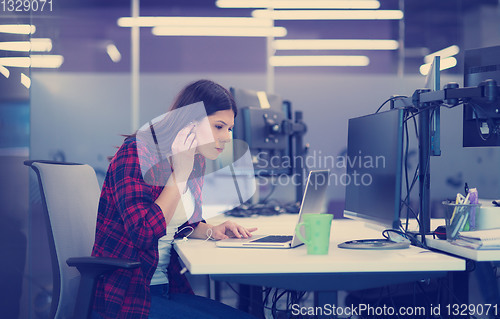 Image of female software developer using laptop computer