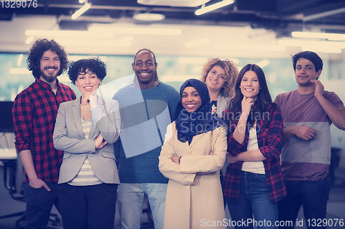 Image of portrait of young excited multiethnics business team