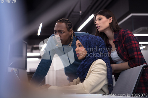 Image of multiethnics team of software developers working together