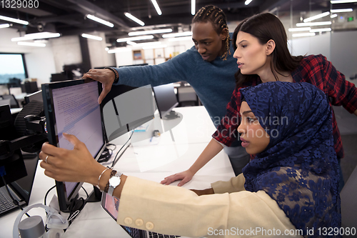 Image of multiethnics team of software developers working together