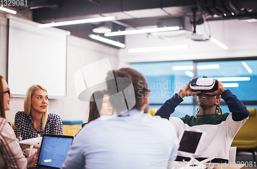 Image of Young Multiethnic Business team using virtual reality headset