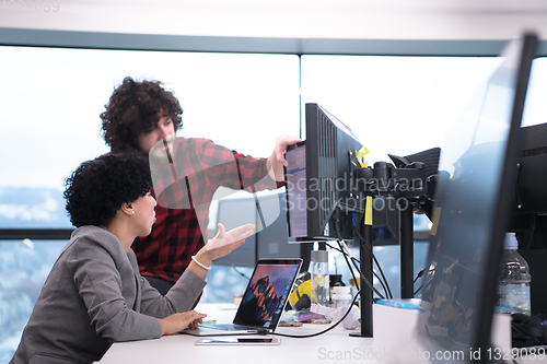 Image of software developers couple writing programming code
