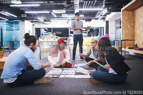 Image of black muslim woman having meeting with Multiethnic  startup busi