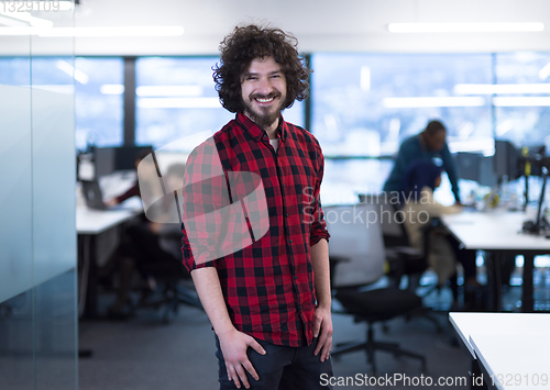 Image of Portrait of smiling male software developer